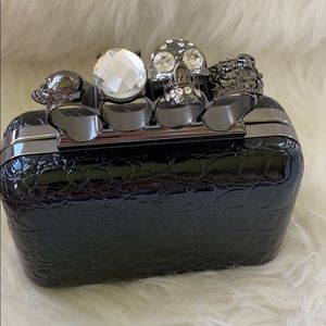 Jeweled four ring clutch bag